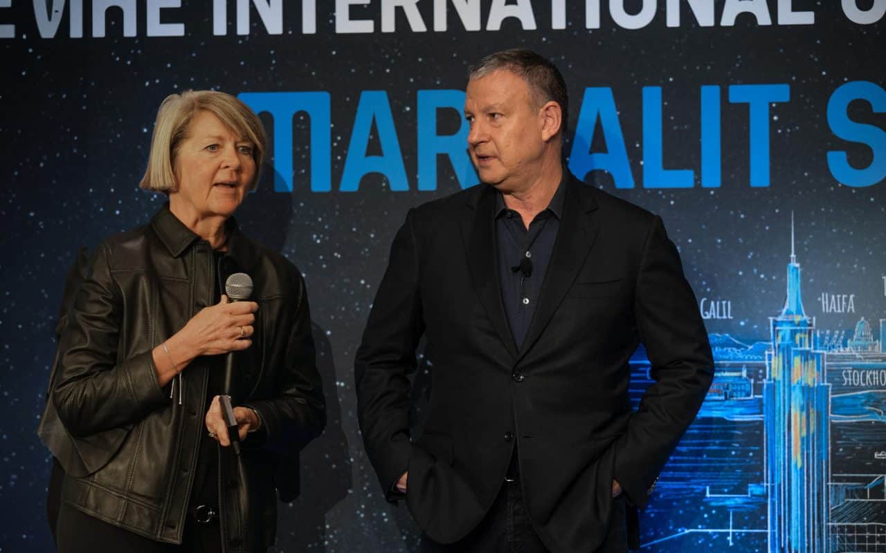 Marge and Erel on stage